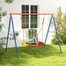 Child on colorful disc swing seat with blue and orange frame in grassy backyard