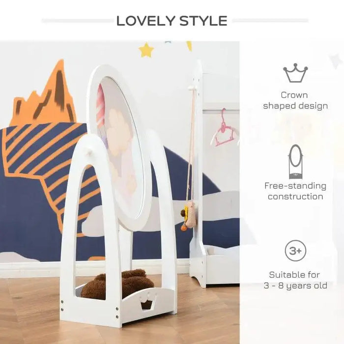 White kids dressing mirror with crown design, free-standing, in a playroom with wall art.