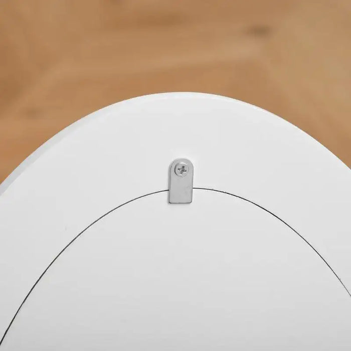 Close-up of white kids' dressing mirror frame with screw and metal bracket