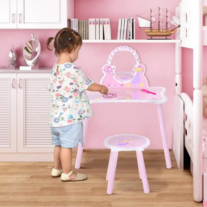 Young child with pink kids dressing table and chair featuring cartoon flower and butterfly design
