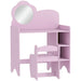 Pink children's vanity with mirror and stool on a white background