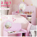 Pink vanity table and study desk with heart-shaped mirrors in a child's room.