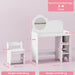 White children's desk and chair with dimensions and recommended age range on a pink background