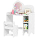 White children's desk with shelves and toys on a white background