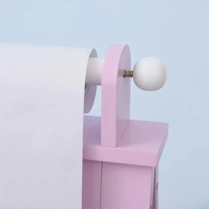 Close-up of pink kids easel paper roll holder with white knob and smooth pastel finish