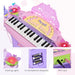 Pink kids electronic keyboard with 32 keys, flashing lights, and MP3 jack, uses AA batteries.