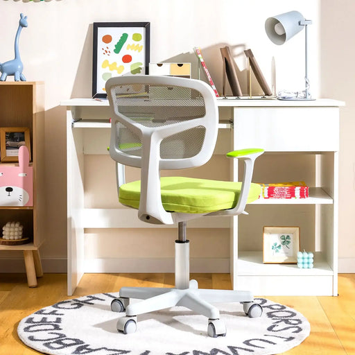 Modern white and green ergonomic office chair on alphabet rug in bright home office with white desk and decor