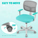 Ergonomic swivel office chair with turquoise cushion, mesh back, armrests, and 360° rotating casters