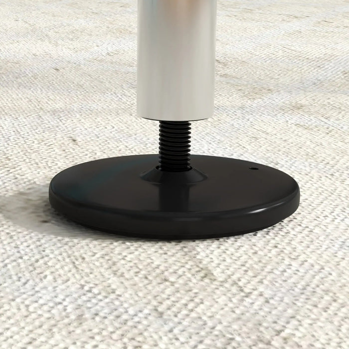 Close-up of adjustable steel gym bar base with black round foot on textured beige surface