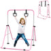 Child playing on pink and silver adjustable steel gymnastics bar with black rings, indoor kids gym equipment