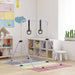 Adjustable purple steel kids gymnastics bar with black rings in bright children's playroom