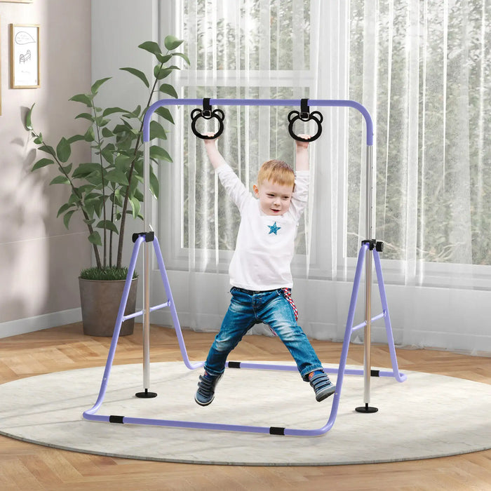 Young boy hanging on adjustable purple steel gymnastics bar with bear-shaped rings indoors on rug