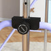 Close-up of adjustable locking knob on a purple and steel kids foldable gymnastics bar indoors