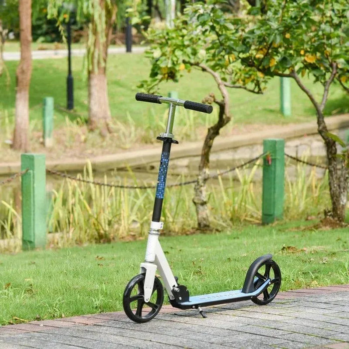 White kids folding kick scooter with adjustable height on a park pathway