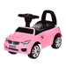 Pink toddler foot-to-floor ride-on car with steering wheel, music, and lights