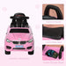 Pink kids foot-to-floor ride-on car with steering wheel, handle, seat, and storage compartment