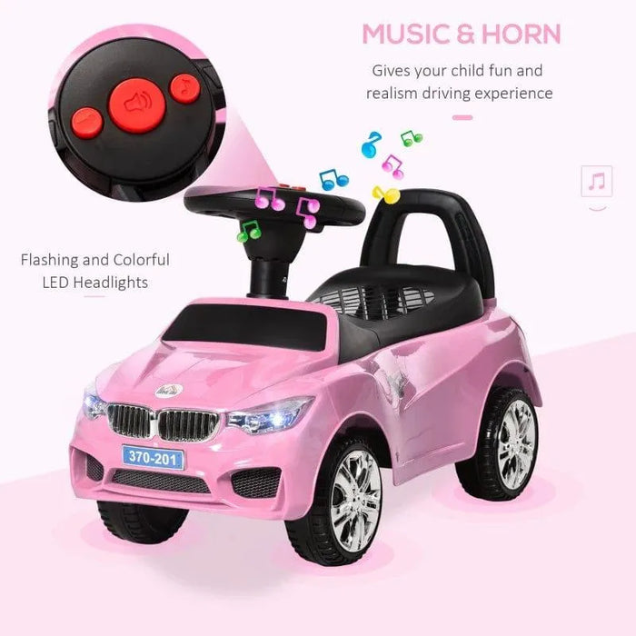Pink kids ride-on car with flashing LED headlights, music horn, and black seat