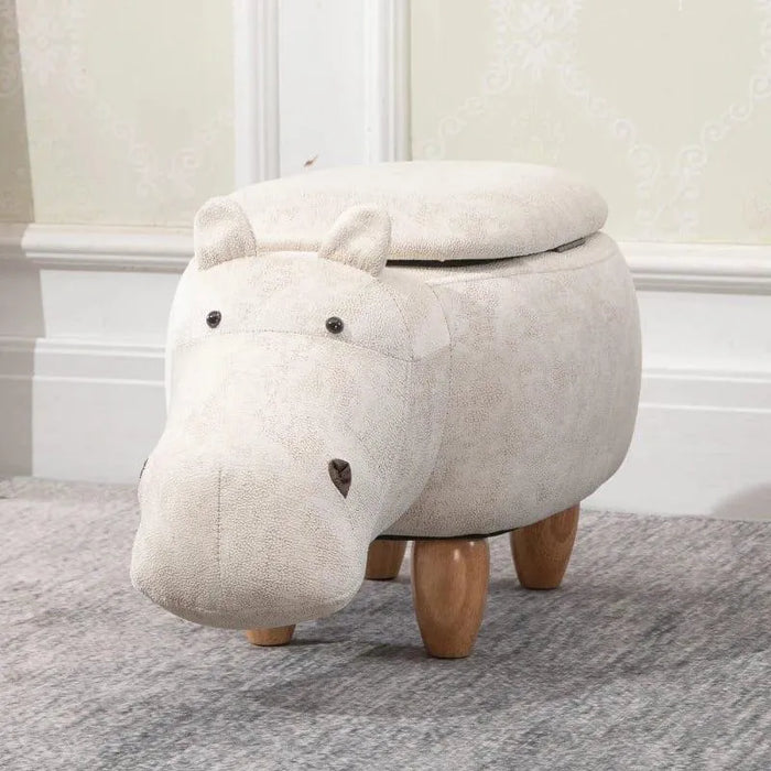 Kids hippo storage stool with wooden legs and hidden compartment on grey carpet