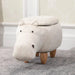 Kids hippo storage stool with wooden legs and hidden compartment on grey carpet