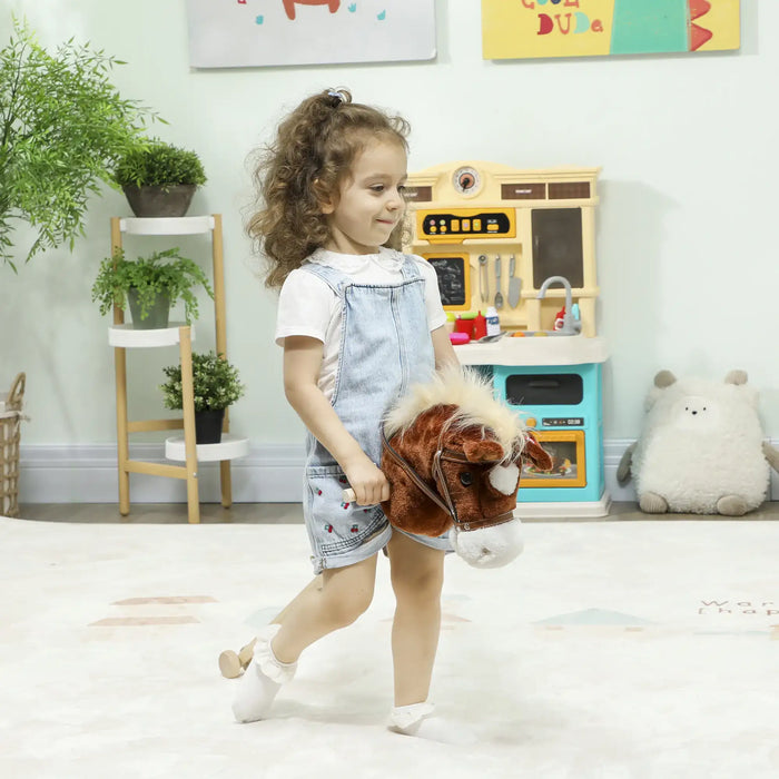 Child holding a plush horse toy in a playroom with toys and plants in the background