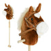 Plush horse head with bridle and reins on a white background