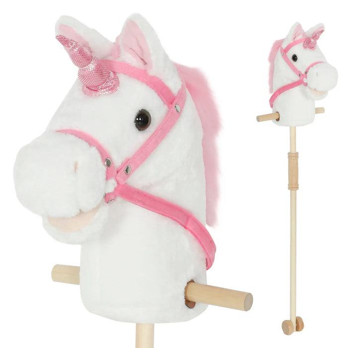 Plush unicorn toy with pink mane and reins on a white background