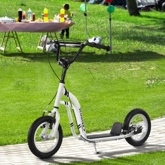 White kids kick scooter with adjustable height and big wheels on park path, picnic in background