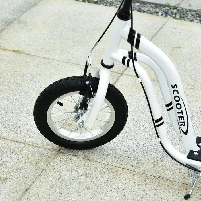 White kids kick scooter with big front wheel and dual brake system on pavement