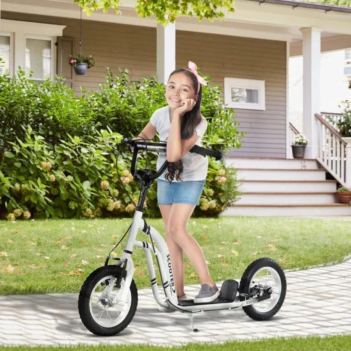 Smiling girl with long hair on white kids kick scooter with big wheels and adjustable handlebar outdoors
