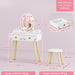 Children's vanity table with stool and mirror, showing dimensions on a pink background