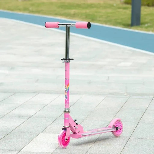 Pink kids light-up music scooter with LED wheels and adjustable height on pavement