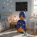 Children's room with space-themed decor, including a suitcase, bed, and wall art.