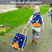 Child with a colorful suitcase and backpack walking outdoors on a paved path.