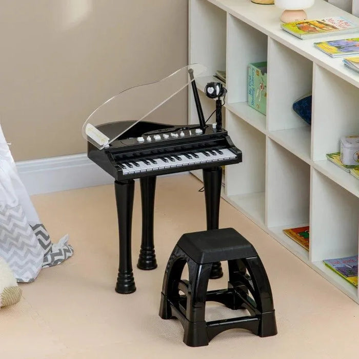 Black kids mini grand piano with 37 keys, LED lights, and matching stool in playroom
