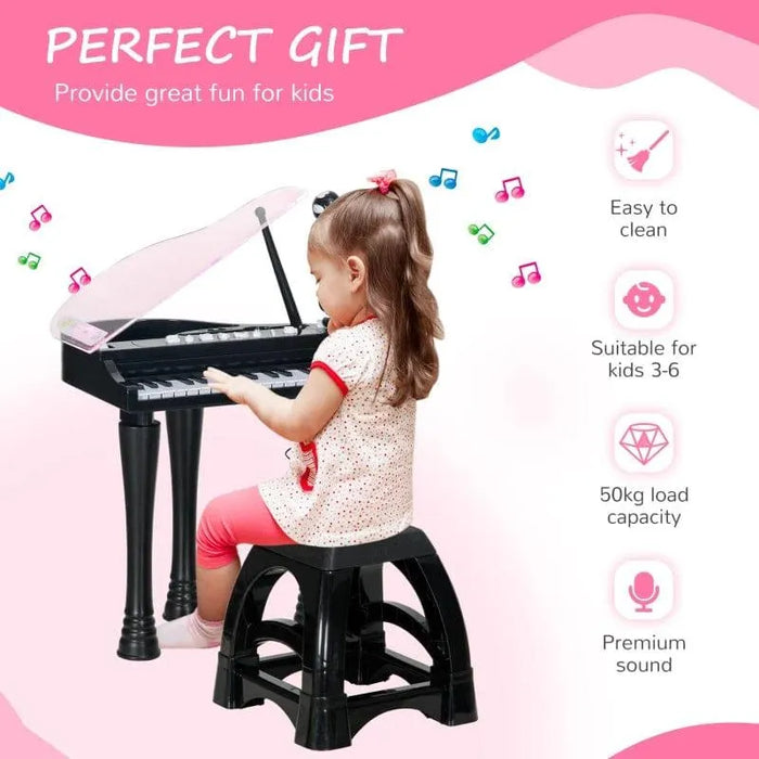 Young girl playing black kids mini grand piano keyboard with LED lights, seated on a matching black stool, with features including easy to clean, suitable for kids ages 3-6, and premium sound highlighted on a pink background.