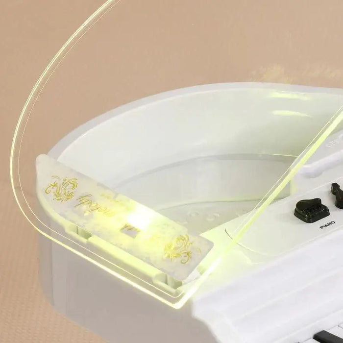 White kids mini grand piano with 37 keys, LED lights, and electronic controls