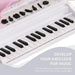 White kids mini grand piano 37-key electronic keyboard with labeled buttons and LED lights
