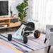 Kids blue and orange pedal go-kart with handbrake and gear lever indoors on rug