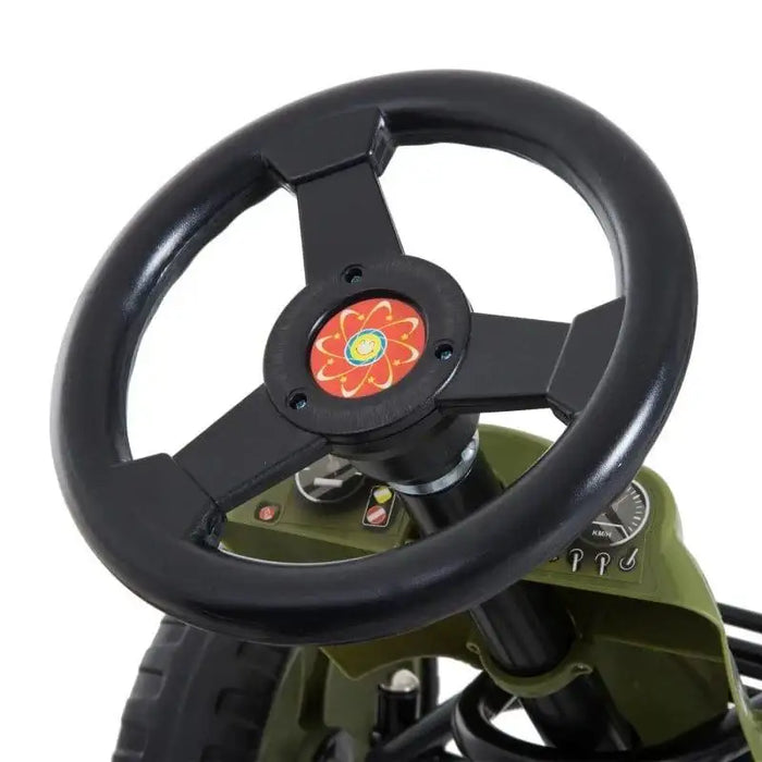 Close-up of green and black kids pedal go-kart steering wheel and control panel