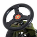Close-up of green and black kids pedal go-kart steering wheel and control panel