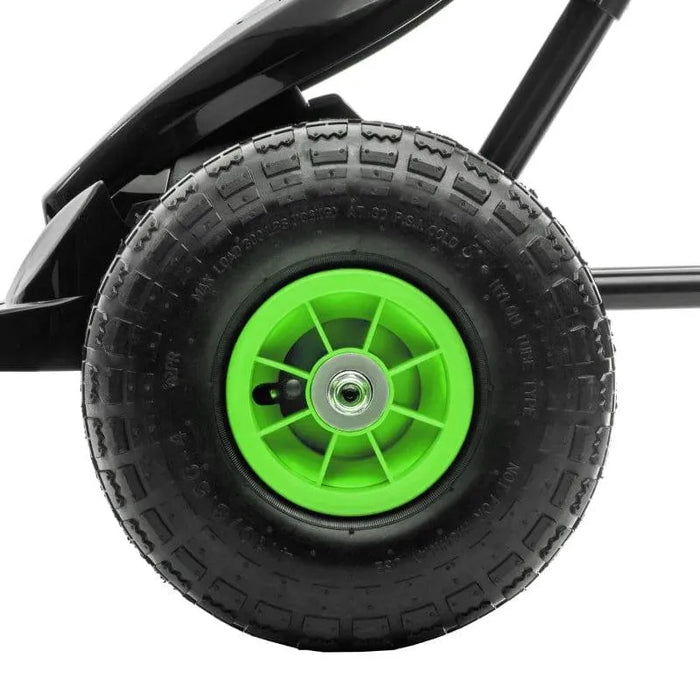 Close-up of green and black pedal go-kart wheel with shock-absorbing suspension