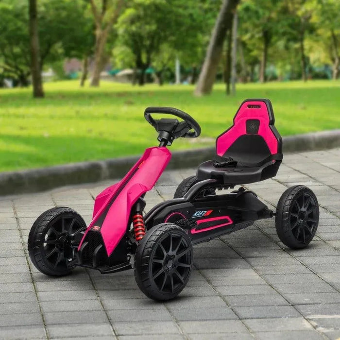 Pink and black kids pedal go kart with adjustable seat and handbrake on paved path outdoors
