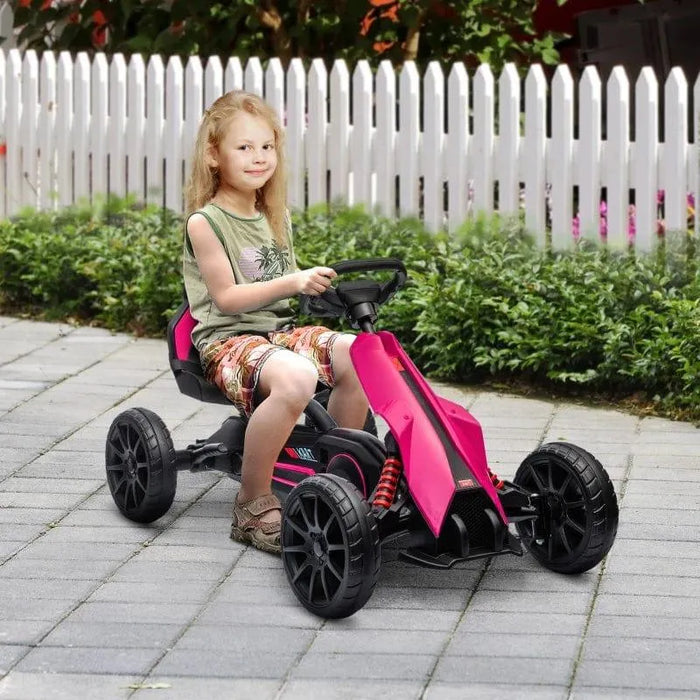 Child riding pink and black kids pedal go kart with adjustable seat outdoors
