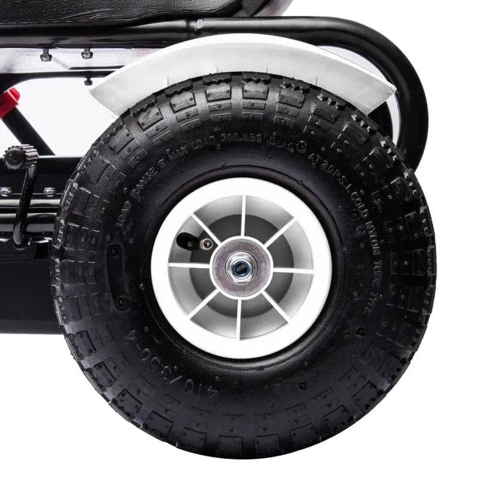 Close-up of kids pedal go kart black tire with white rim and handbrake mechanism