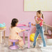 Two girls playing with pink kids' piano keyboard set and microphone in a pastel playroom