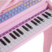 Kids pink piano keyboard set with 37 keys, colorful buttons, and note labels