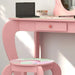 Kids pink vanity table with animal design, acrylic mirror, round stool, and drawer storage