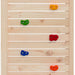 Wooden climbing wall panel with colorful orange, green, red, and blue climbing holds