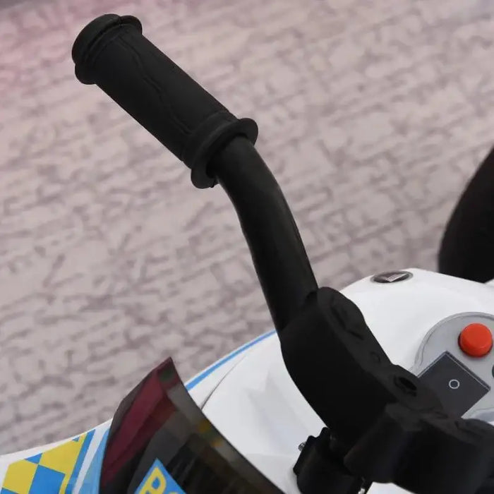 Close-up of kids' blue police ride-on motorbike handlebar and dashboard details