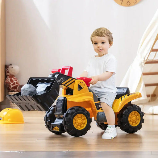 Child playing with a toy bulldozer indoors